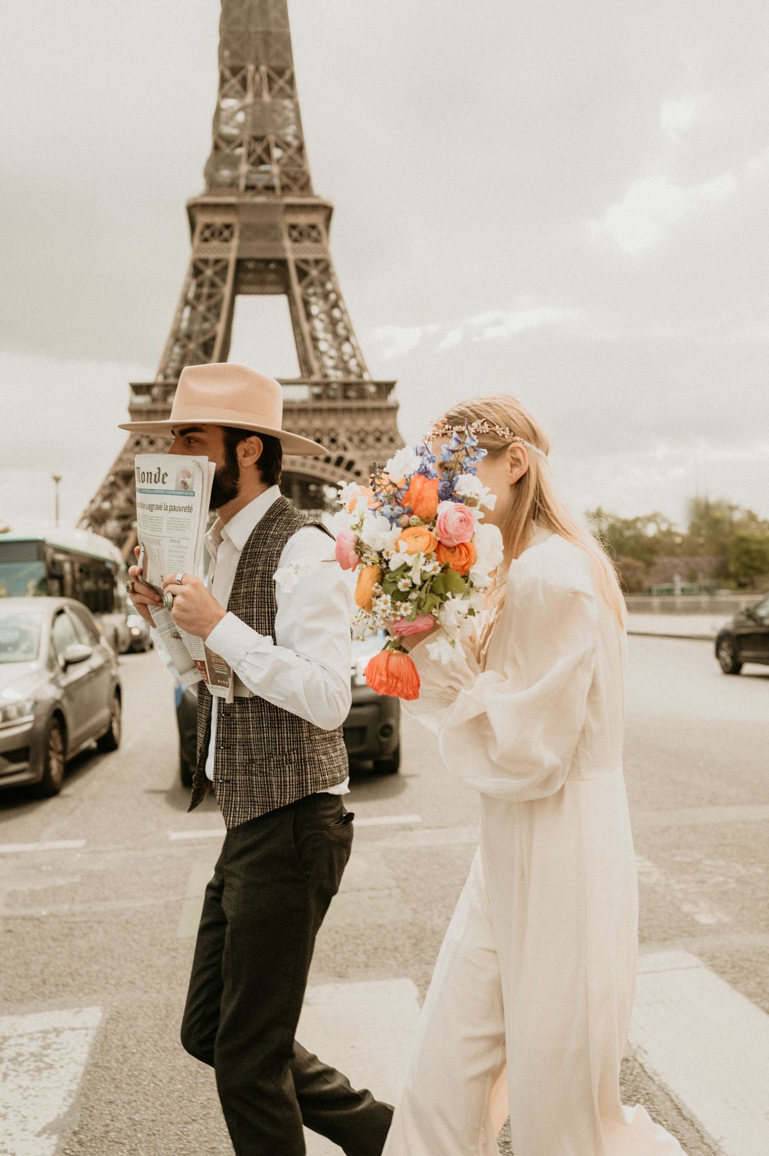 Vintage-inspired couple in romantic Parisian photoshoot with Eiffel Tower backdrop.