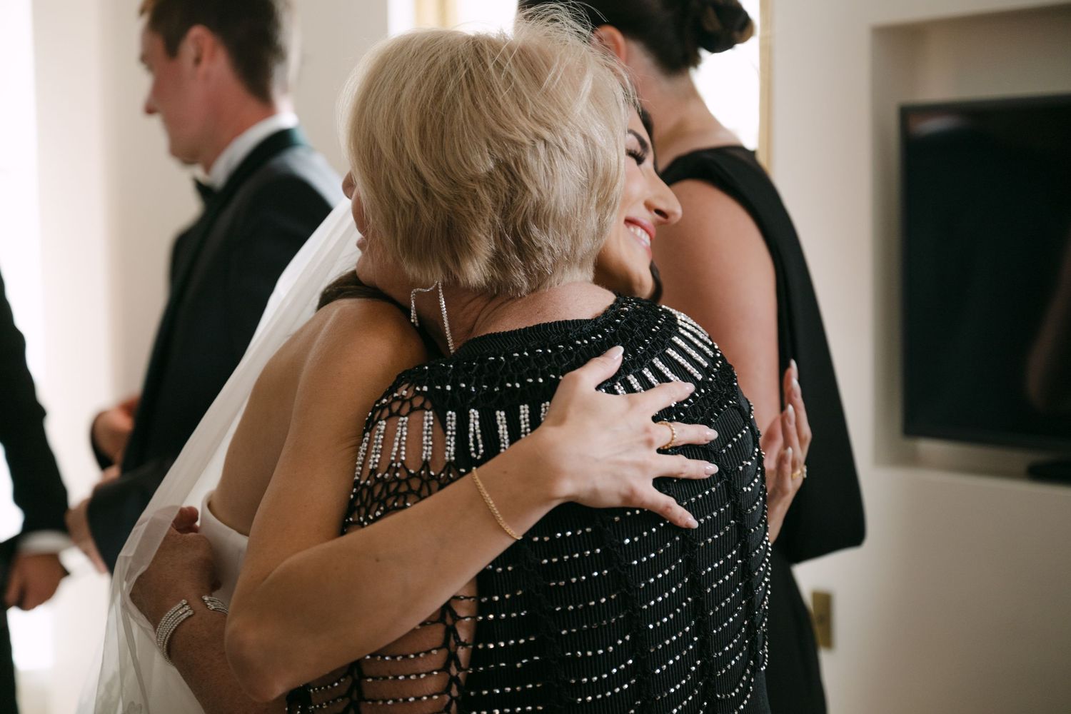 A series of black and white photos showing couples dancing and embracing at what appears to be a formal event.