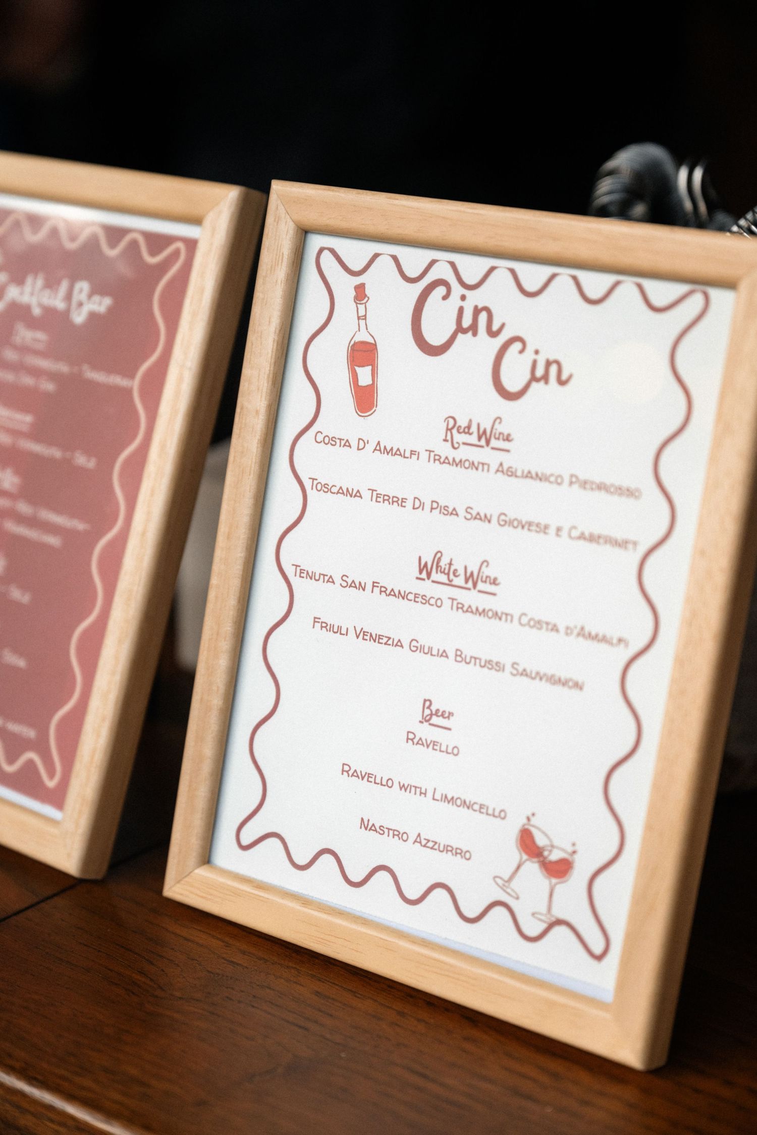 Elegant framed Cin Cin wine and beer menu card displayed at an Italian destination wedding reception.