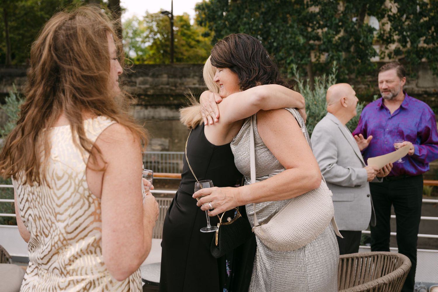 A series of candid outdoor wedding moments captured on a patio with warm evening lighting and romantic atmosphere.