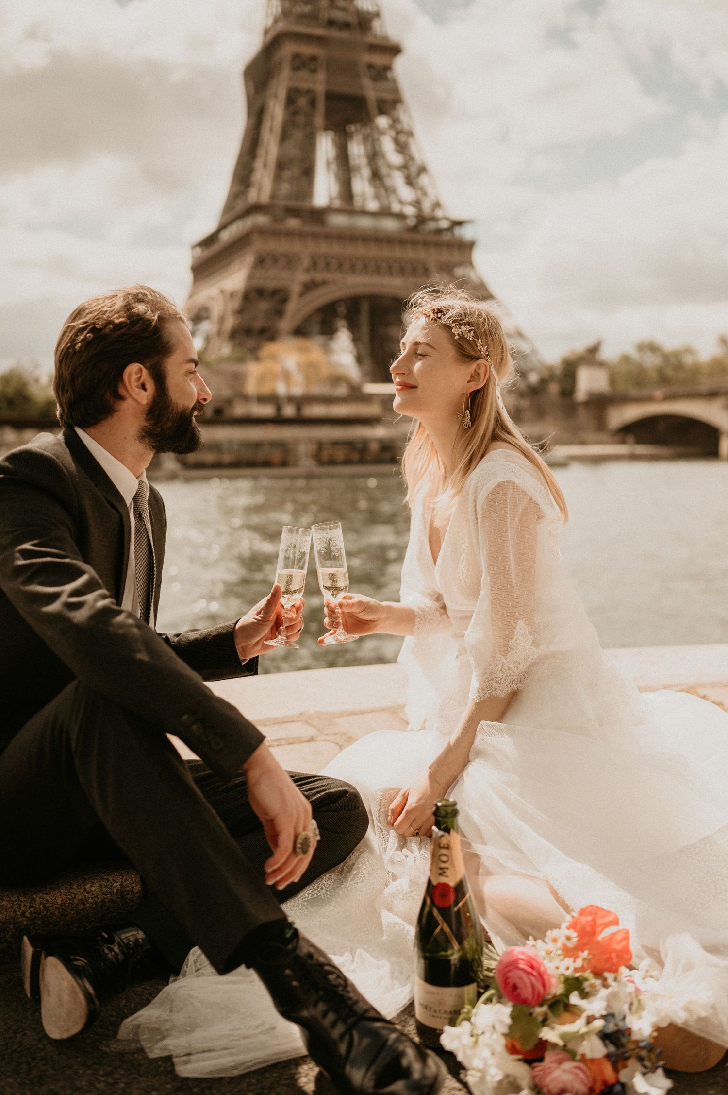 A tender moment shared between newlyweds during their Paris celebration near the Eiffel Tower.