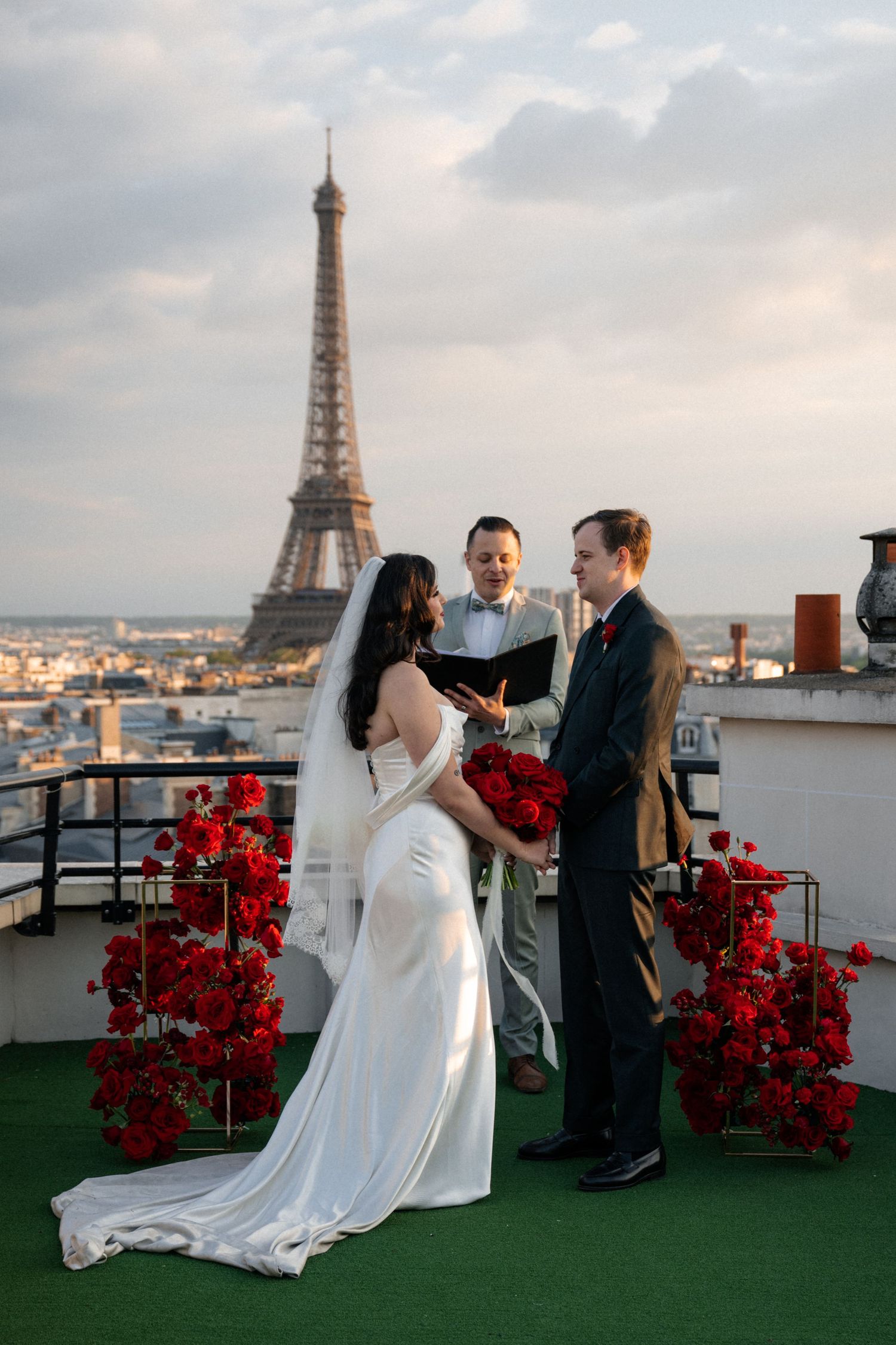 A romantic rooftop celebration in Paris with the iconic Eiffel Tower in the background during golden hour.
