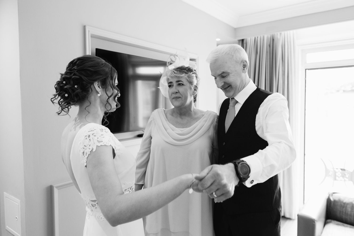 Black and white wedding photo collage showing intimate moments of a bridal party getting ready.