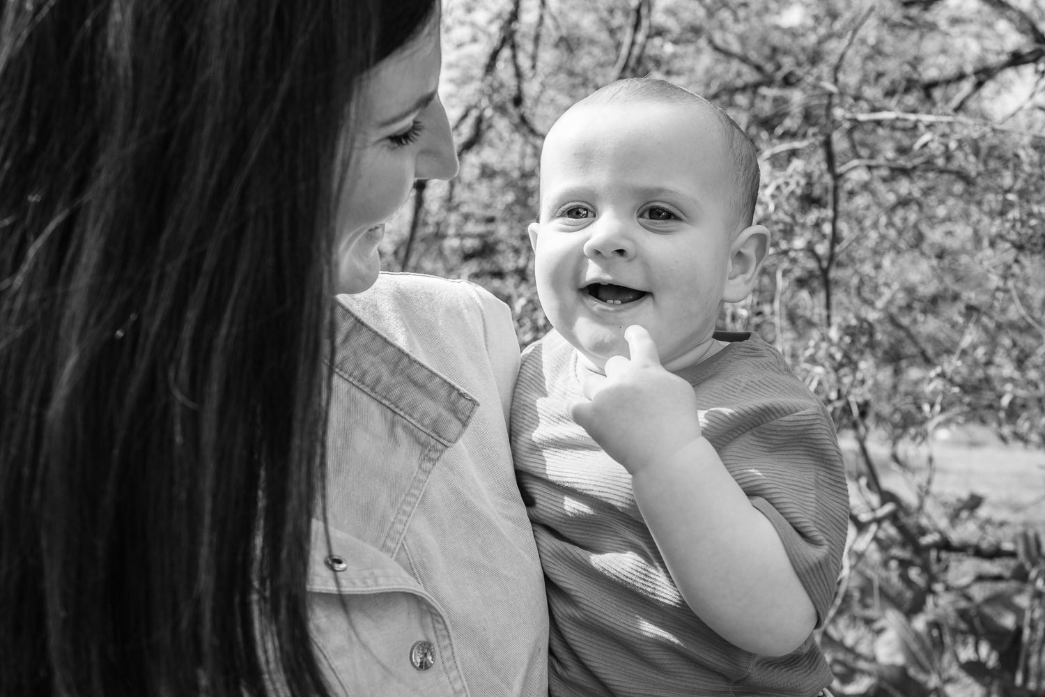 Black and white portrait capturing a tender moment of shared joy.