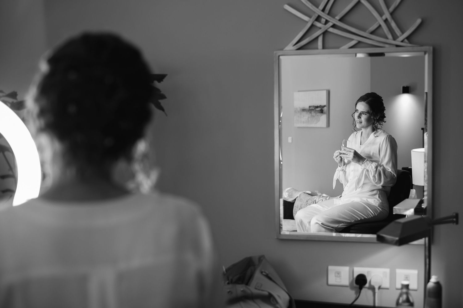 Black and white photos showing intimate reflective moments in mirror sequences.