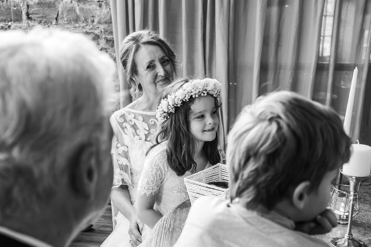 Tender moment shared during wedding ceremony with floral decorations.