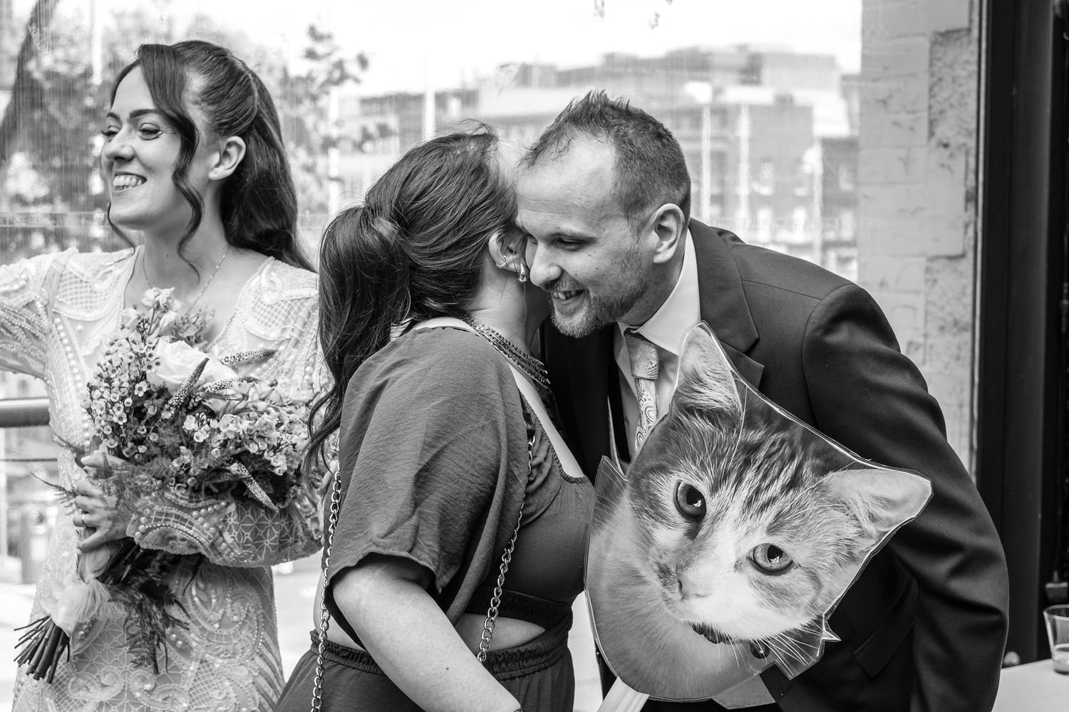 Wedding party shares candid moments and laughter during outdoor photos.