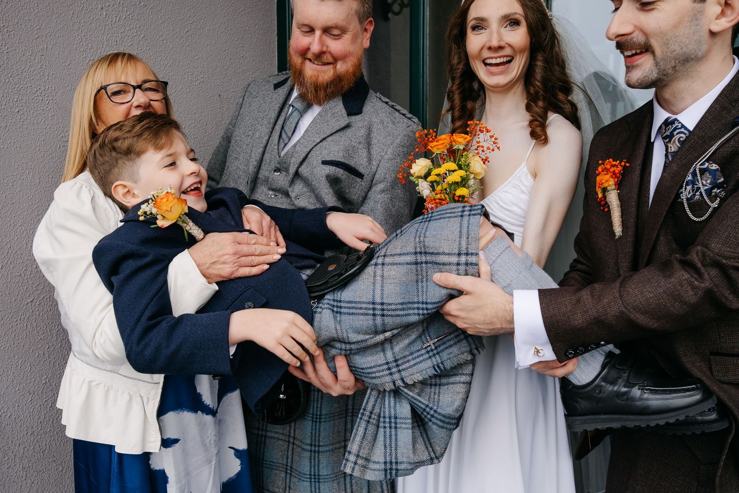 Candid moments from a wedding celebration showing joyful interactions between guests and the wedding party.