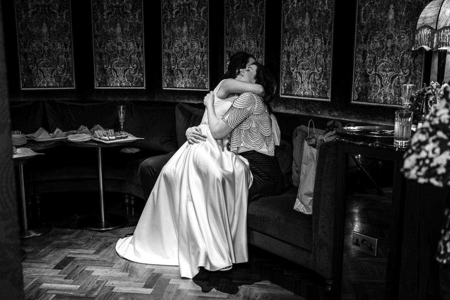 A dramatic black and white photo of someone in a flowing white gown.