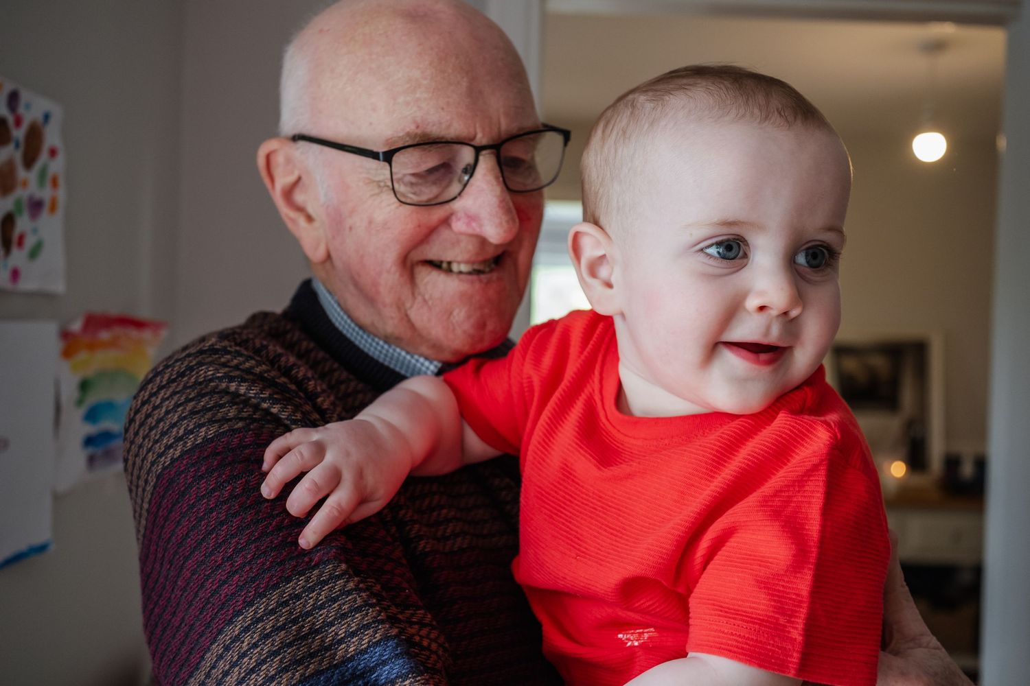 Heartwarming moment shared between generations during indoor family time.