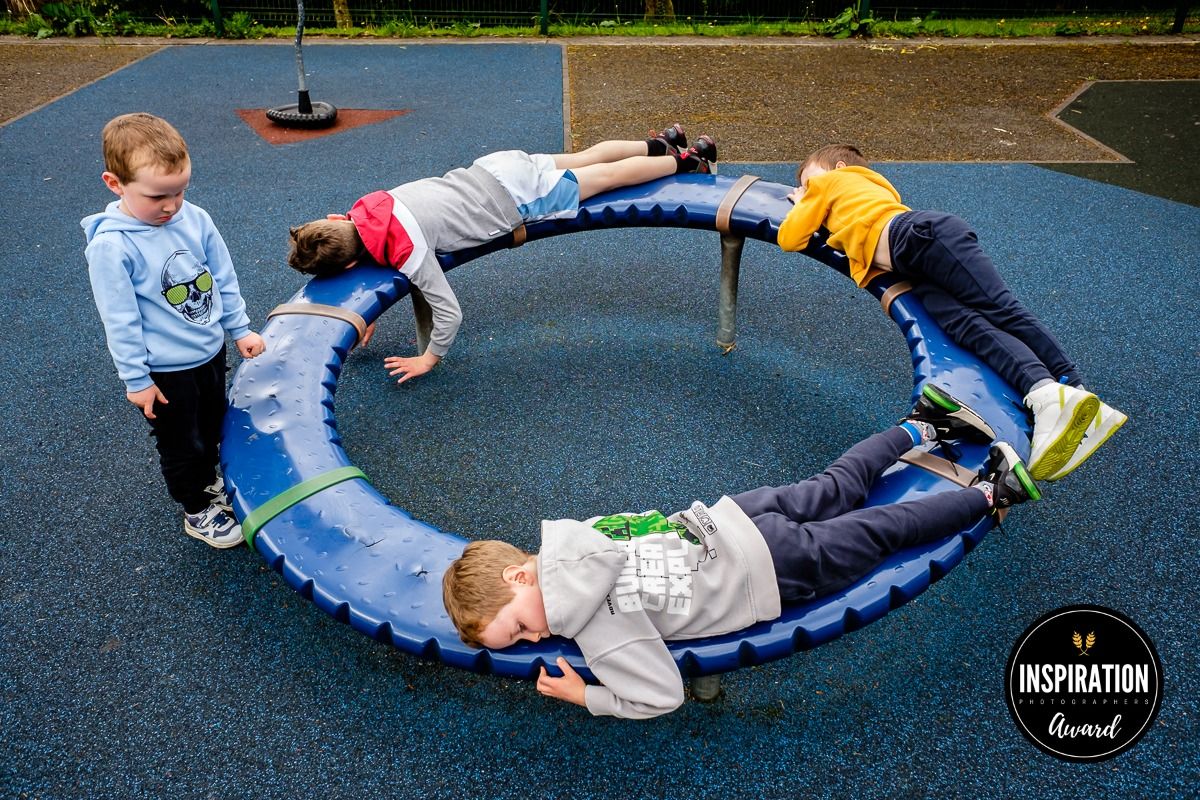 A sequence of photos showing someone performing a circular rolling movement on outdoor pavement.