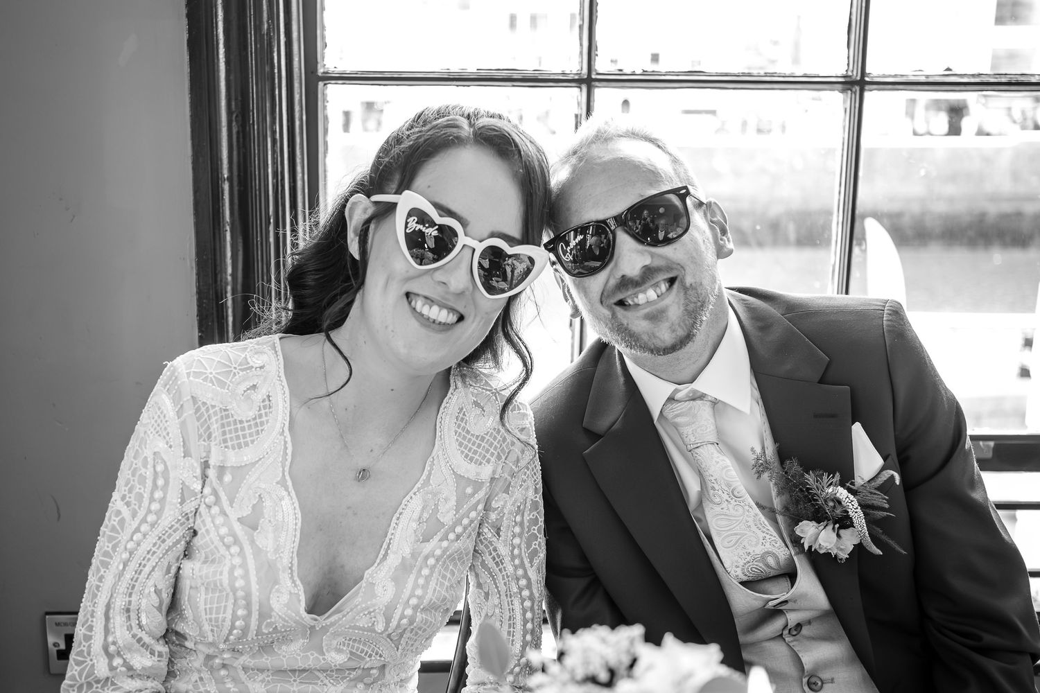 Couple in formal wedding attire sharing intimate moments in a black and white photo collage.