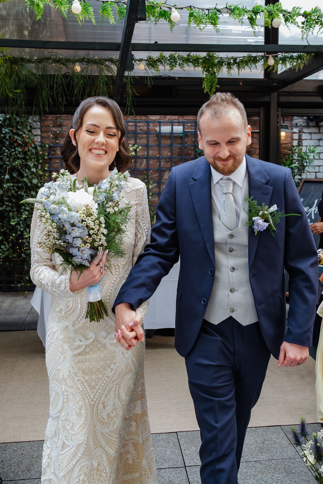 Couple laughing during rooftop wedding ceremony at The Woollen Mills Dublin