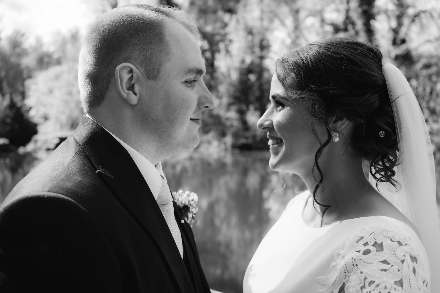 Wedding couple shares intimate moments in black and white photography series.