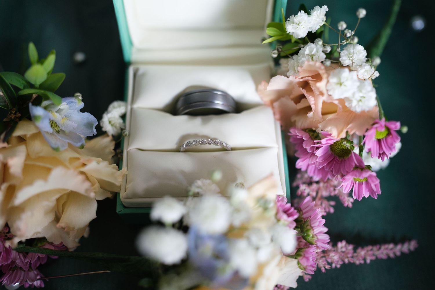 Delicate white and pink floral arrangements with soft focus.