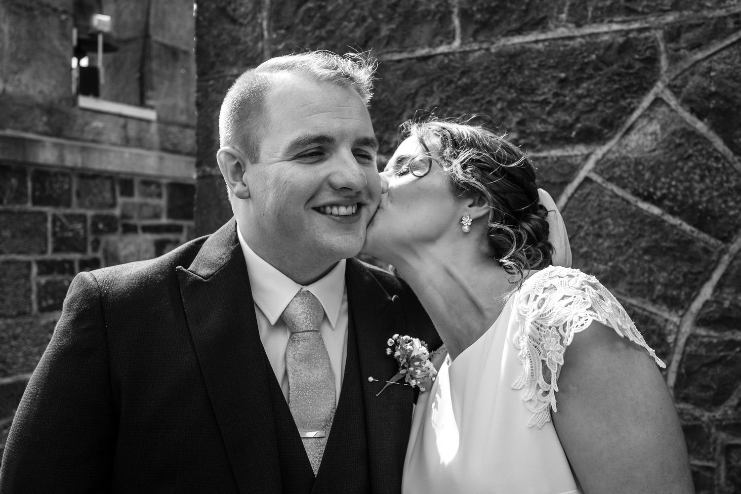 Sequence of romantic black and white wedding photos showing joyful moments between newlyweds.
