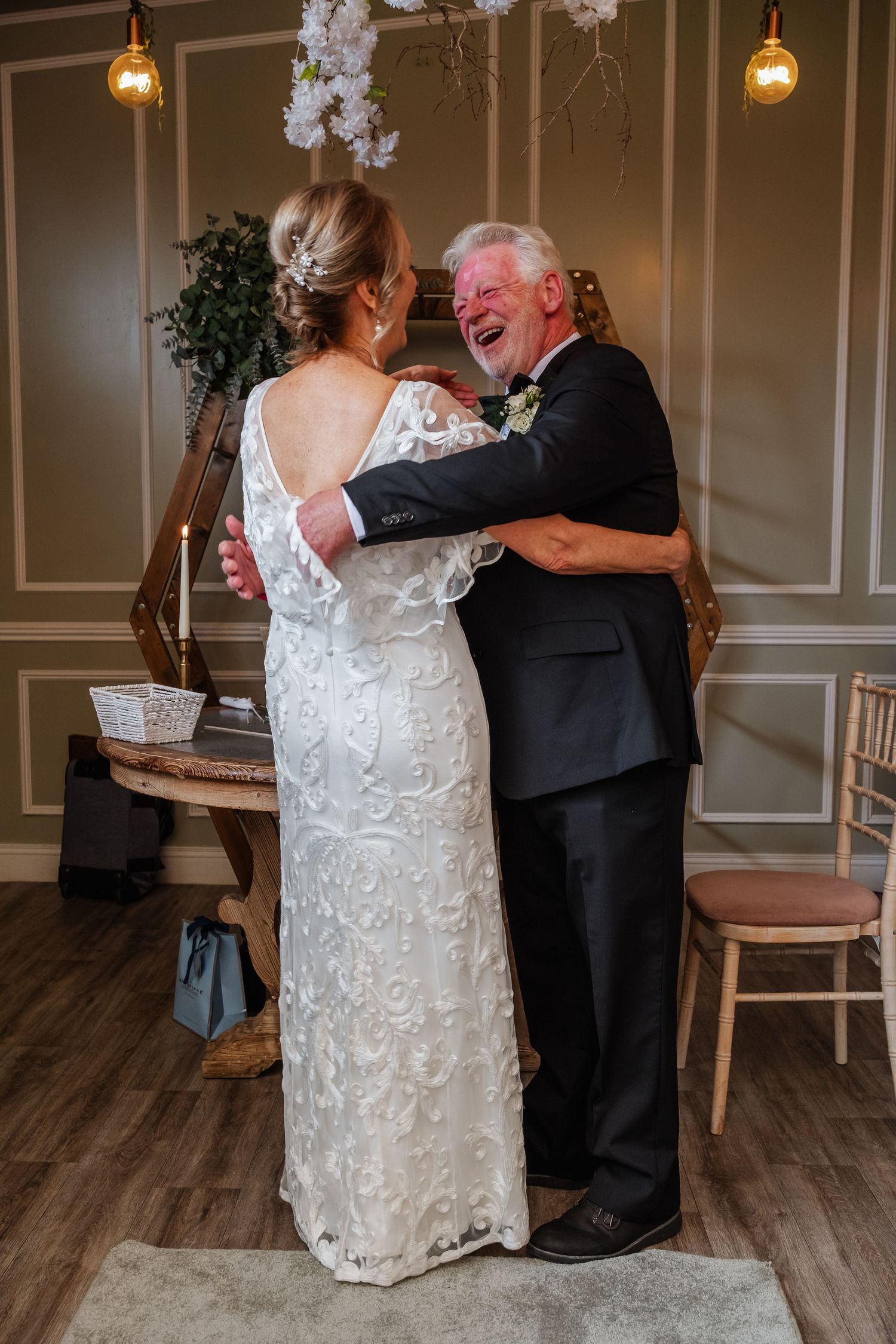 Warm embrace shared between loved ones during emotional gathering.
