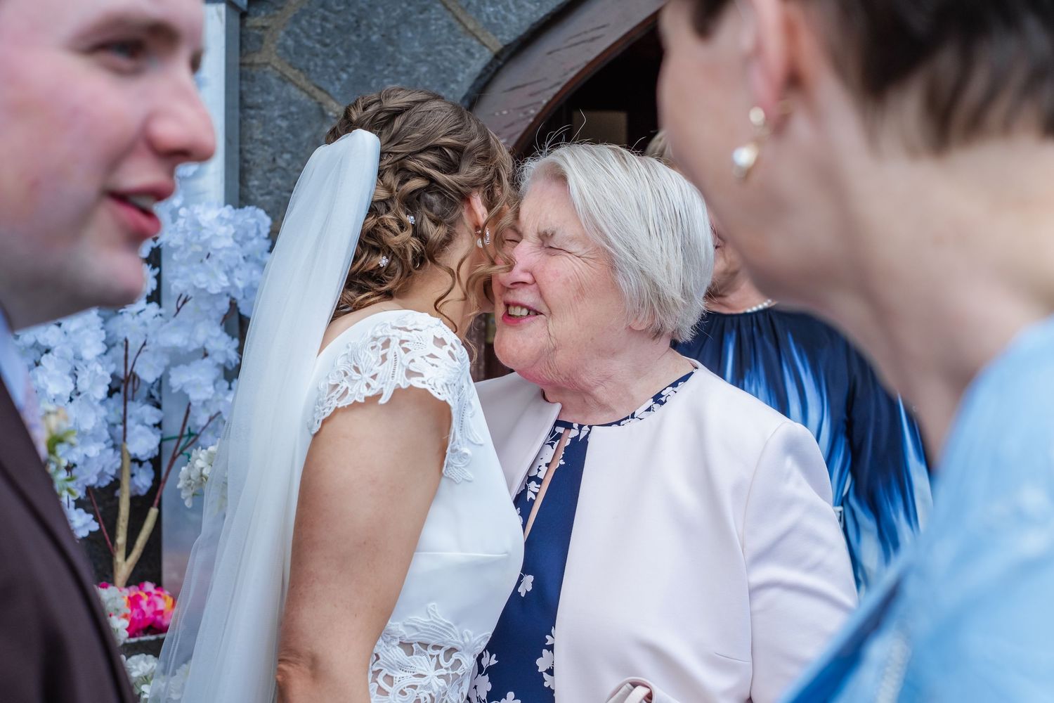 Multiple generations of wedding guests showing emotion and joy during a heartfelt celebration.