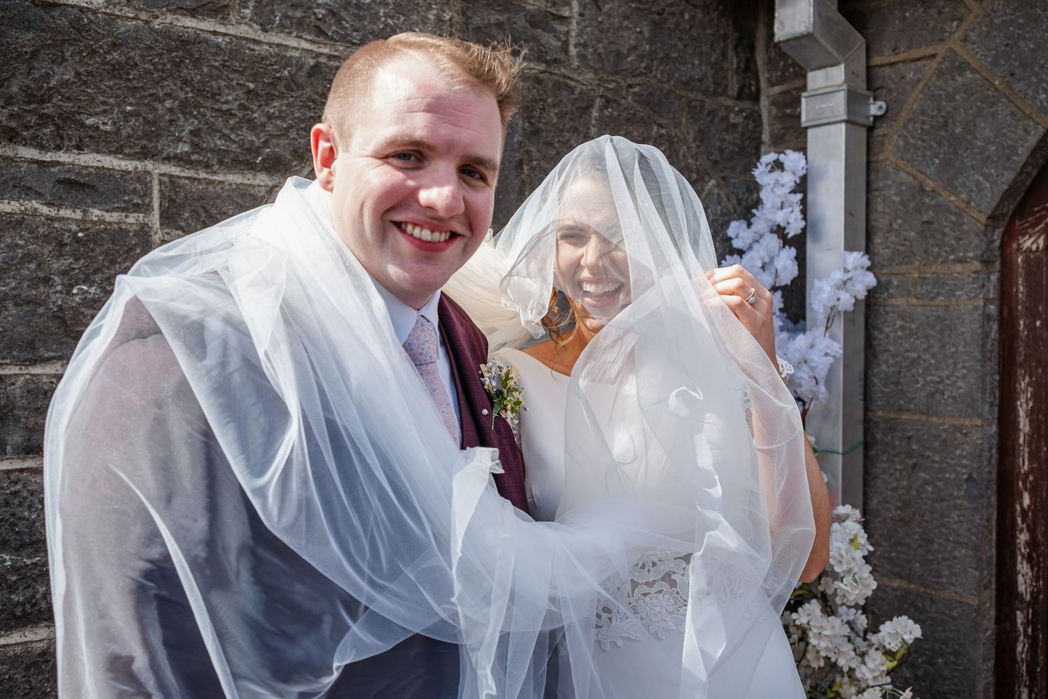 Series of candid wedding photos capturing laughter and loving moments between a couple in formal attire.