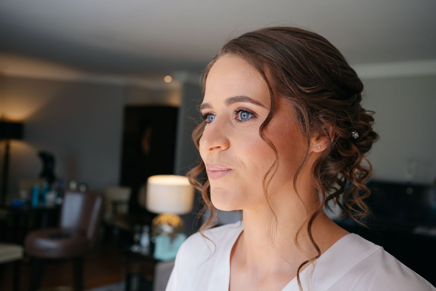 Elegant bridal preparation photos showing close-up detail shots in natural lighting.