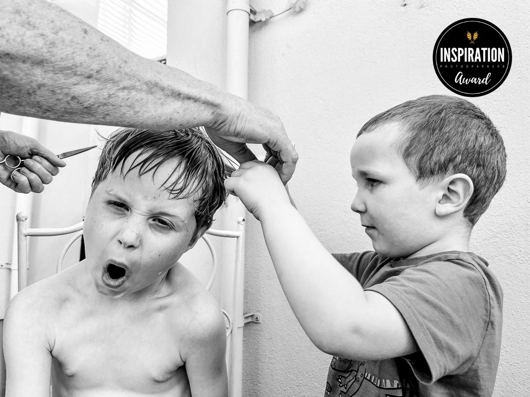 A sequence of black and white photos showing a young child making various exaggerated facial expressions.