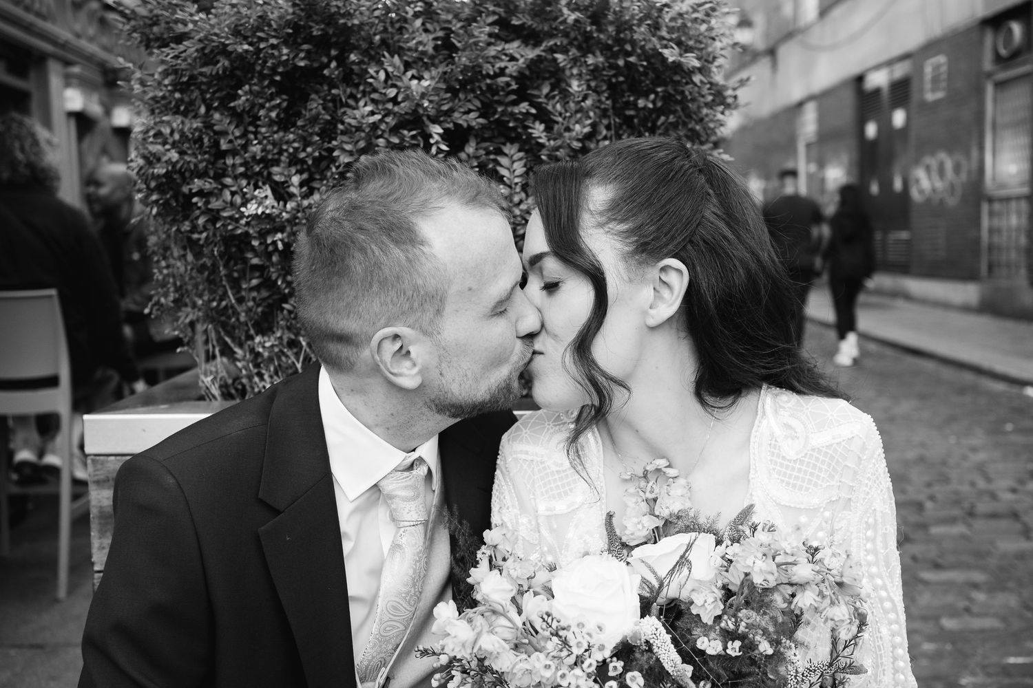 Black and white wedding portraits captured in an urban setting.