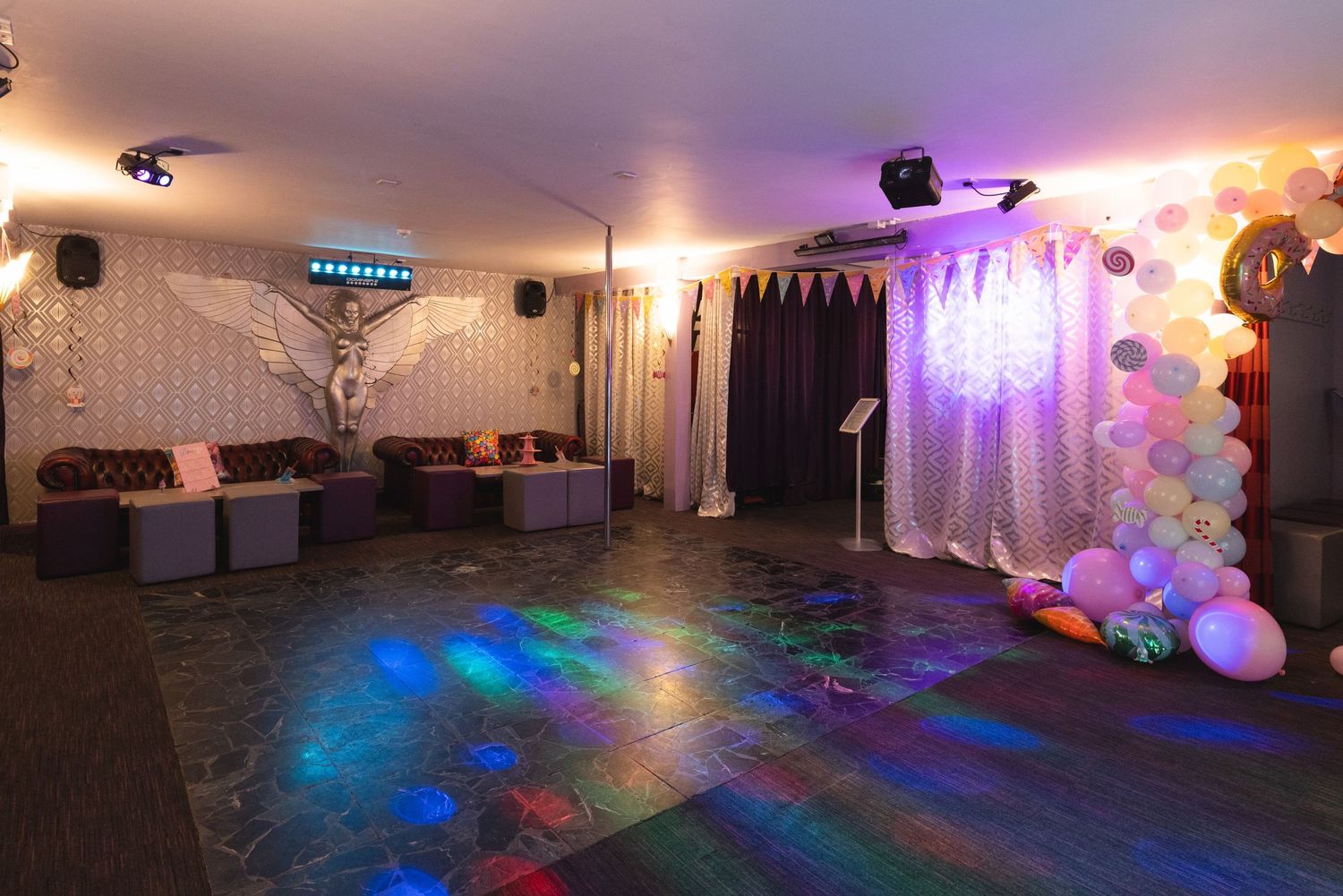 Empty dance floor with disco lighting and DJ setup at Liberty Elite Lutterworth, nightclub interior photography