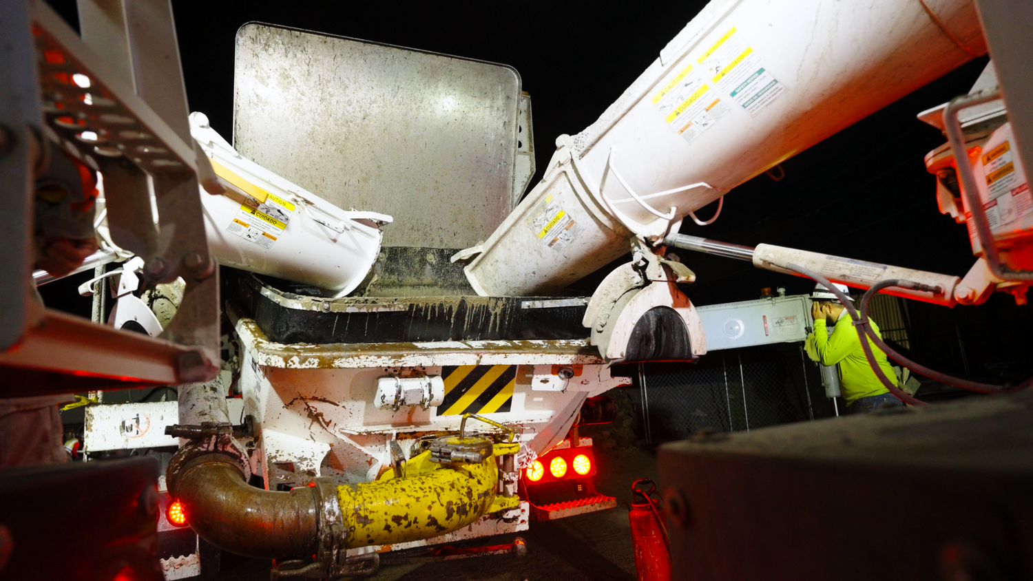 Concrete pouring equipment in action captured by Kin & Lens Creative Media construction photographer in Dallas Fort Worth