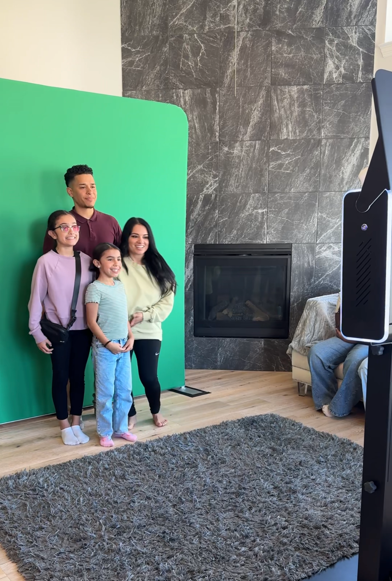 Family posing at the DSLR photo booth behind the scenes with Kin & Lens Creative Media, event photo booth rental in Dallas Fort Worth
