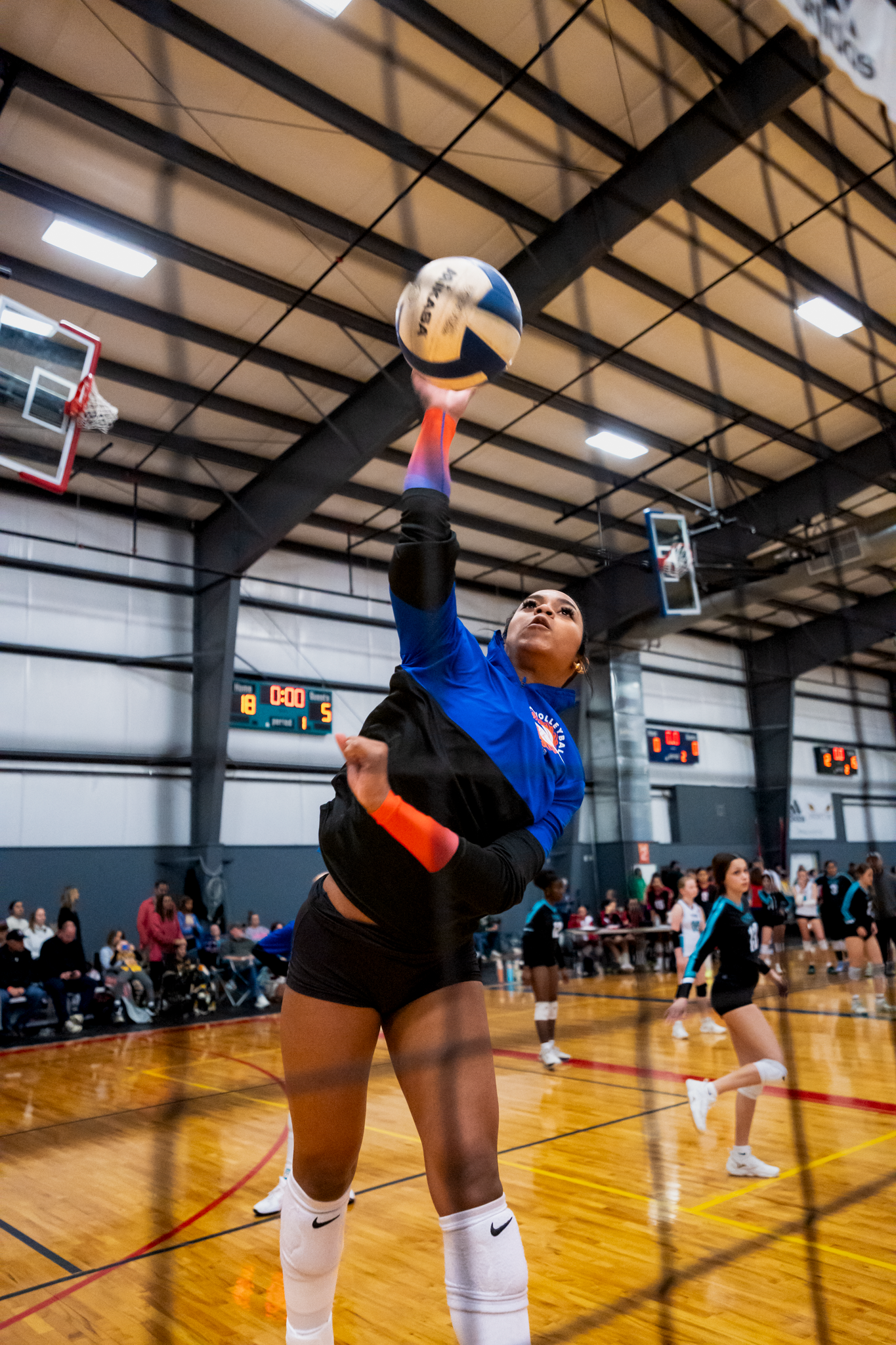 Volleyball athlete jumping for spike during tournament captured by Kin & Lens Creative Media sports photographer in Little Elm Texas
