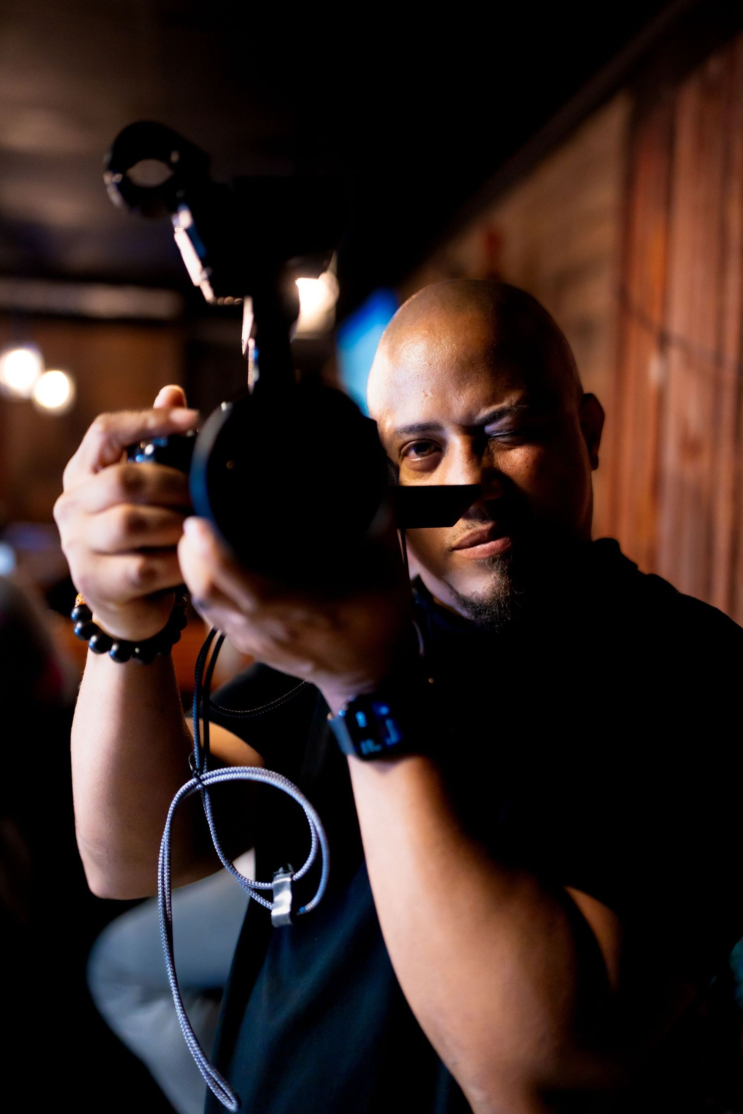Videographer Andre Calder capturing event footage for Solid Rock Productions LLC with Kin & Lens Creative Media in Addison Texas