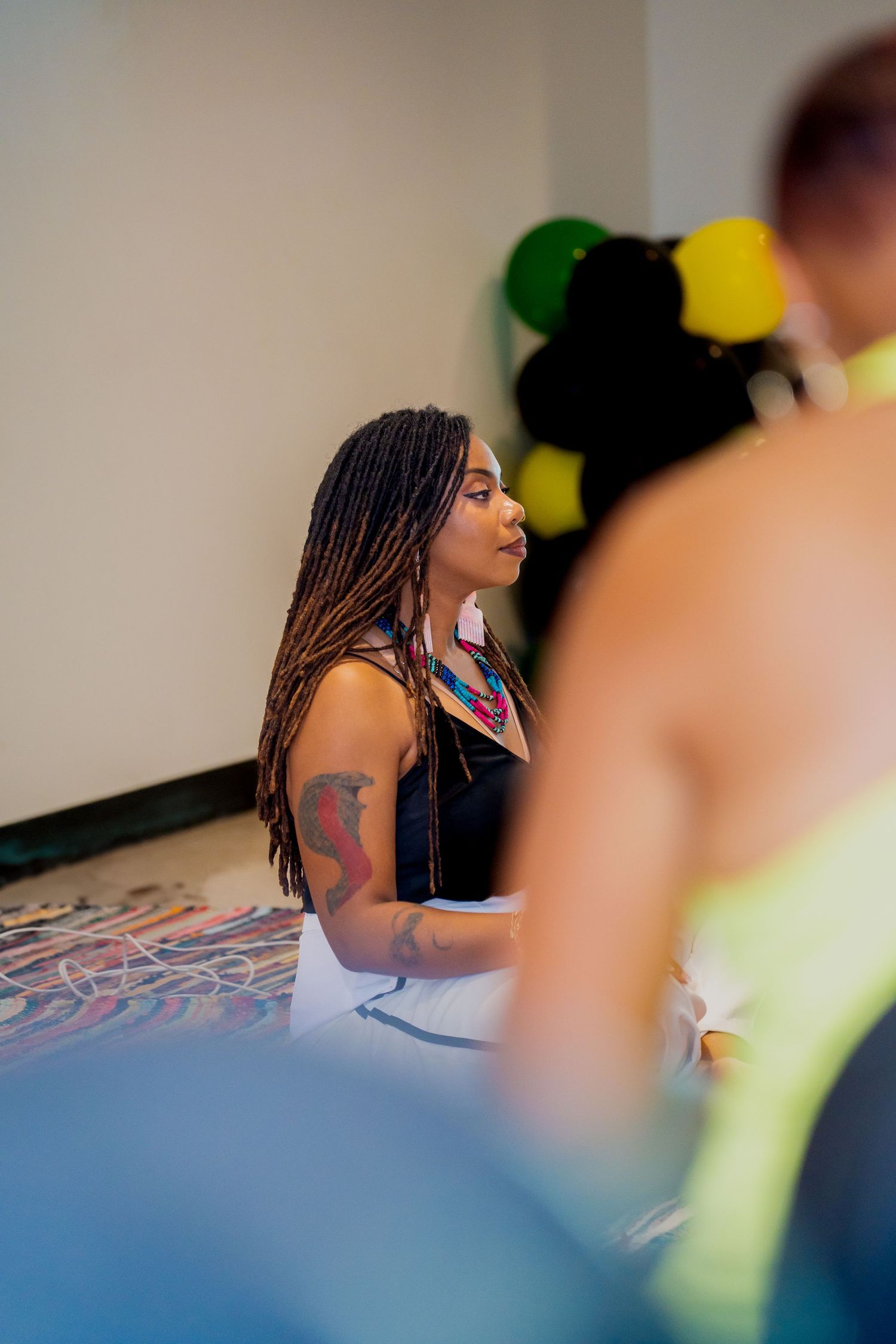 woman in sitting pose at local Juneteenth event captured by Kin & Lens Creative Media event photographer in Frisco Texas