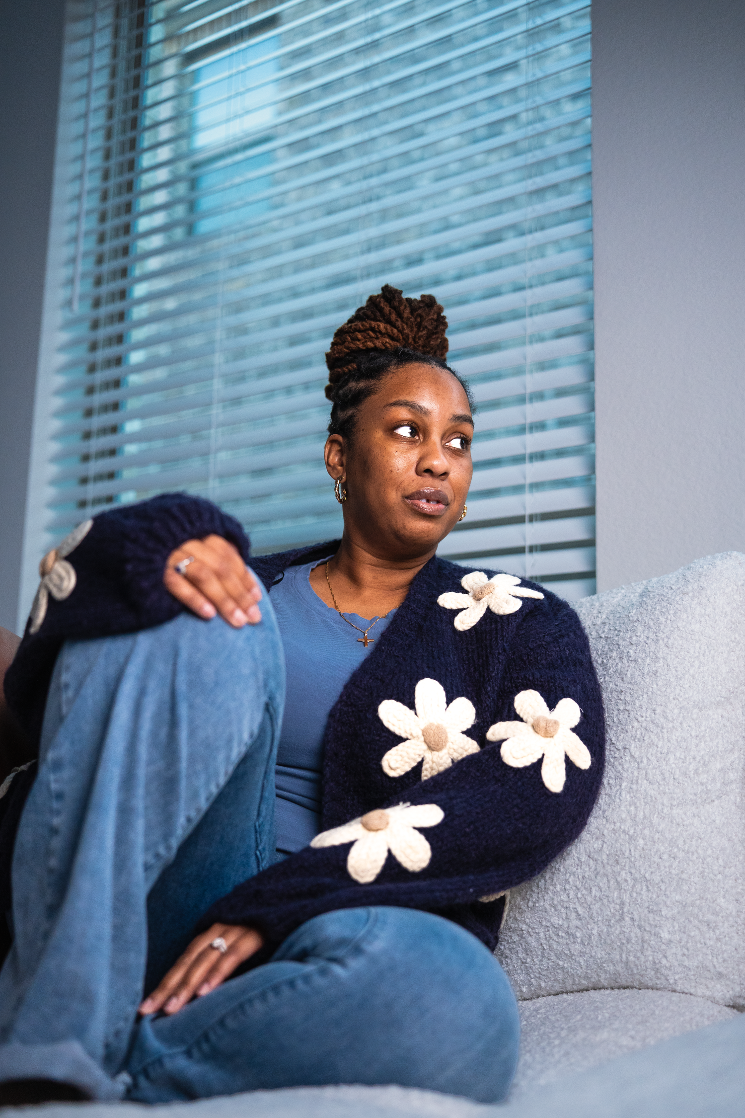 Lifestyle portrait of woman sitting on couch captured by Kin & Lens Creative Media portrait photographer in Frisco Texas