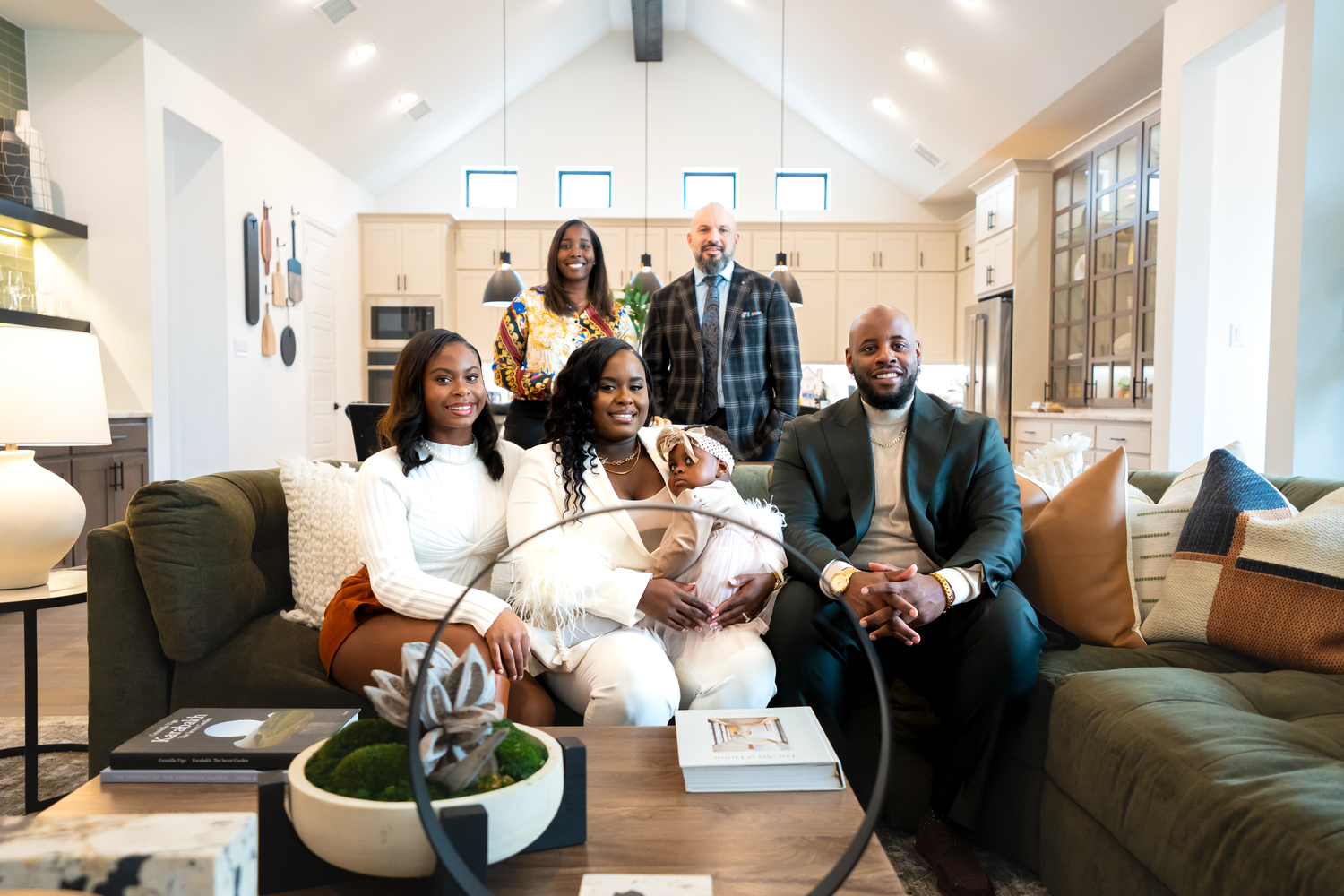 A beautiful family in a modern office space after closing on their first home in Rockwall, TX by Kin & Lens Creative Media