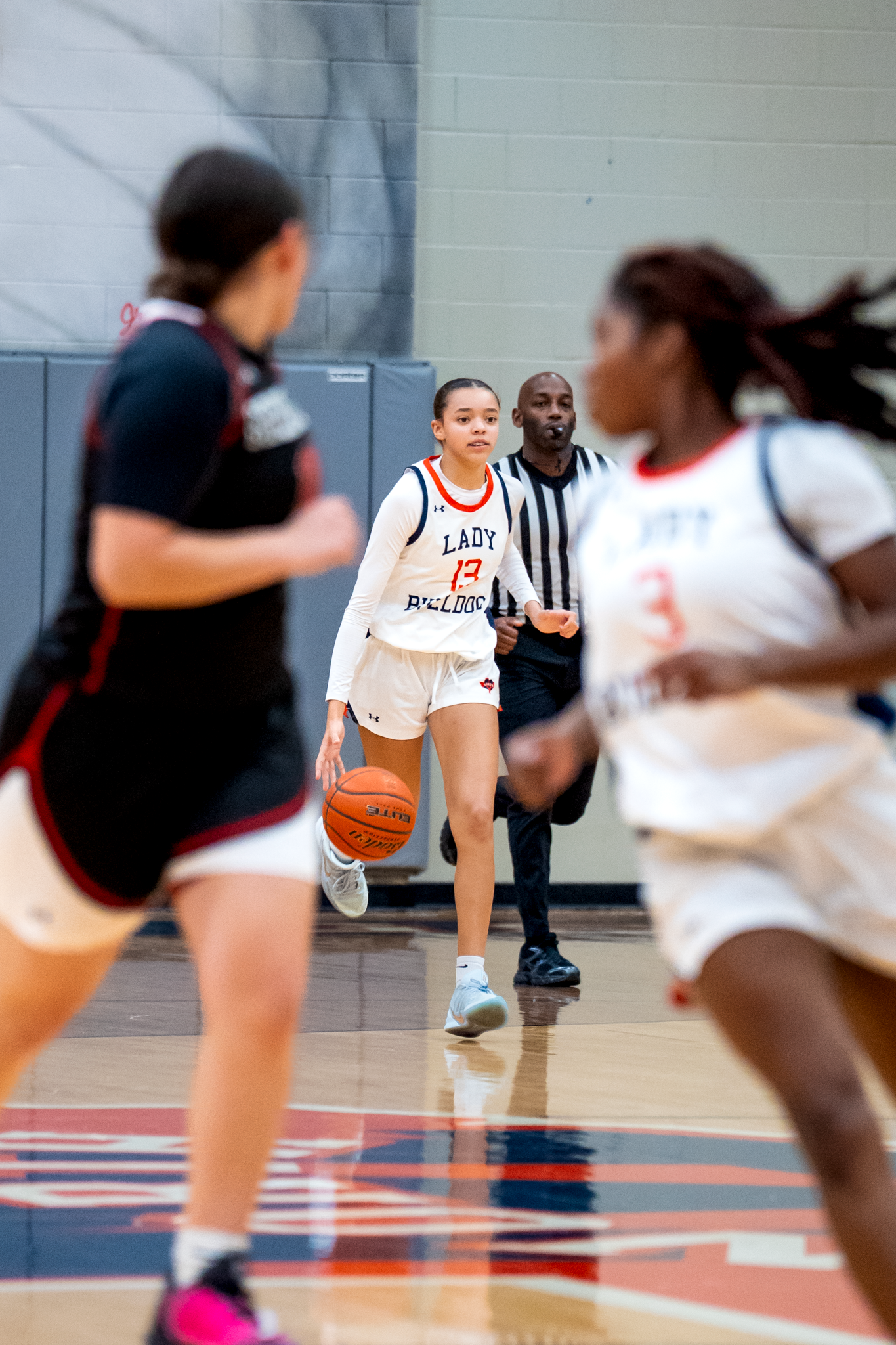 Girls basketball game action captured by Kin & Lens Creative Media youth sports photographer in Dallas Fort Worth