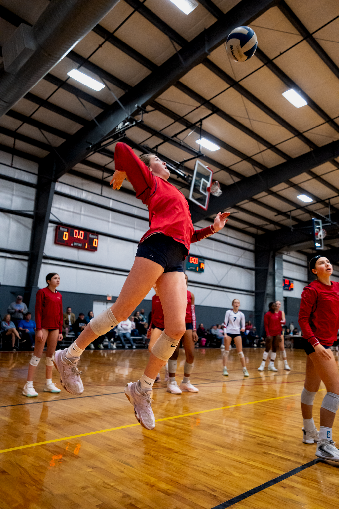 Volleyball player attacking ball during match photographed by Kin & Lens Creative Media sports photographer in Frisco Texas