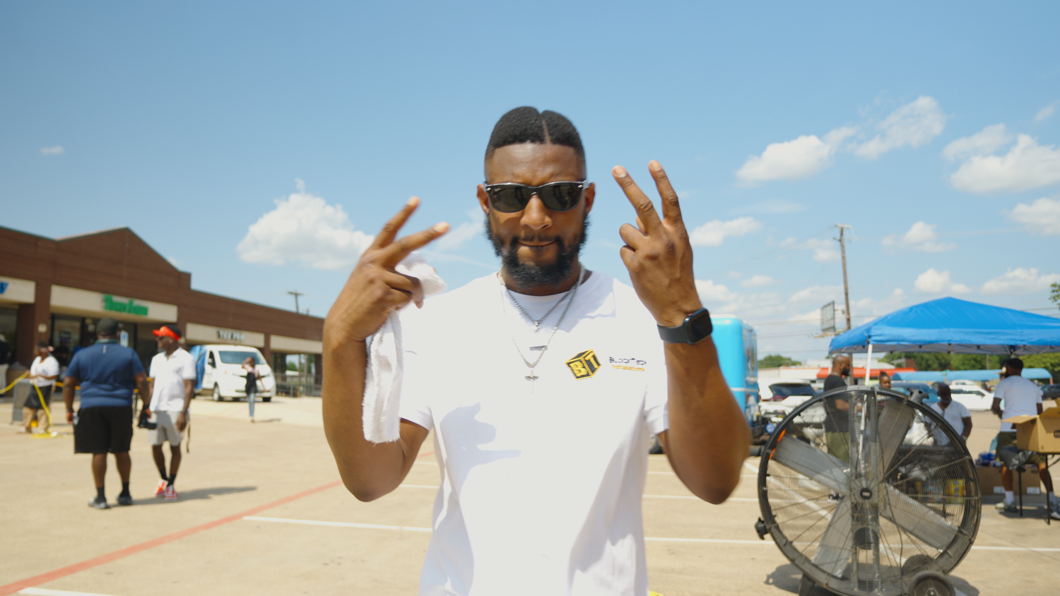Guest posing during outdoor community event photographed by Kin & Lens Creative Media event photographer in Frisco Texas