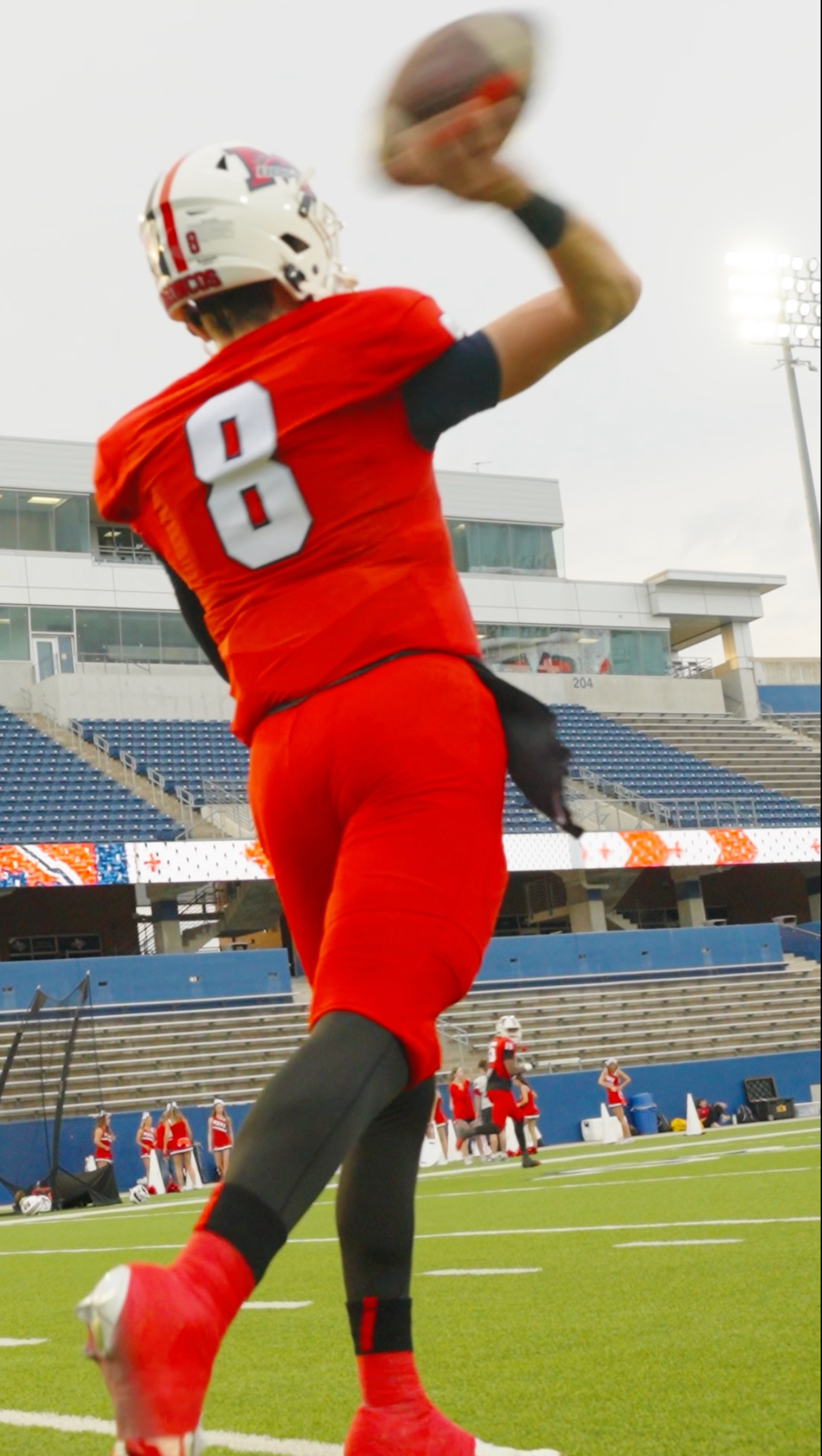 High school football quarterback throwing pass during game captured by Kin & Lens Creative Media sports photographer in Dallas Fort Worth