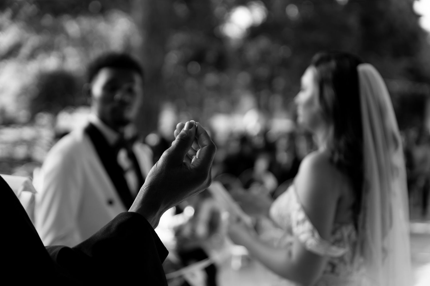 Black and white wedding ceremony moment captured by Kin & Lens Creative Media wedding photographer in Dallas Fort Worth