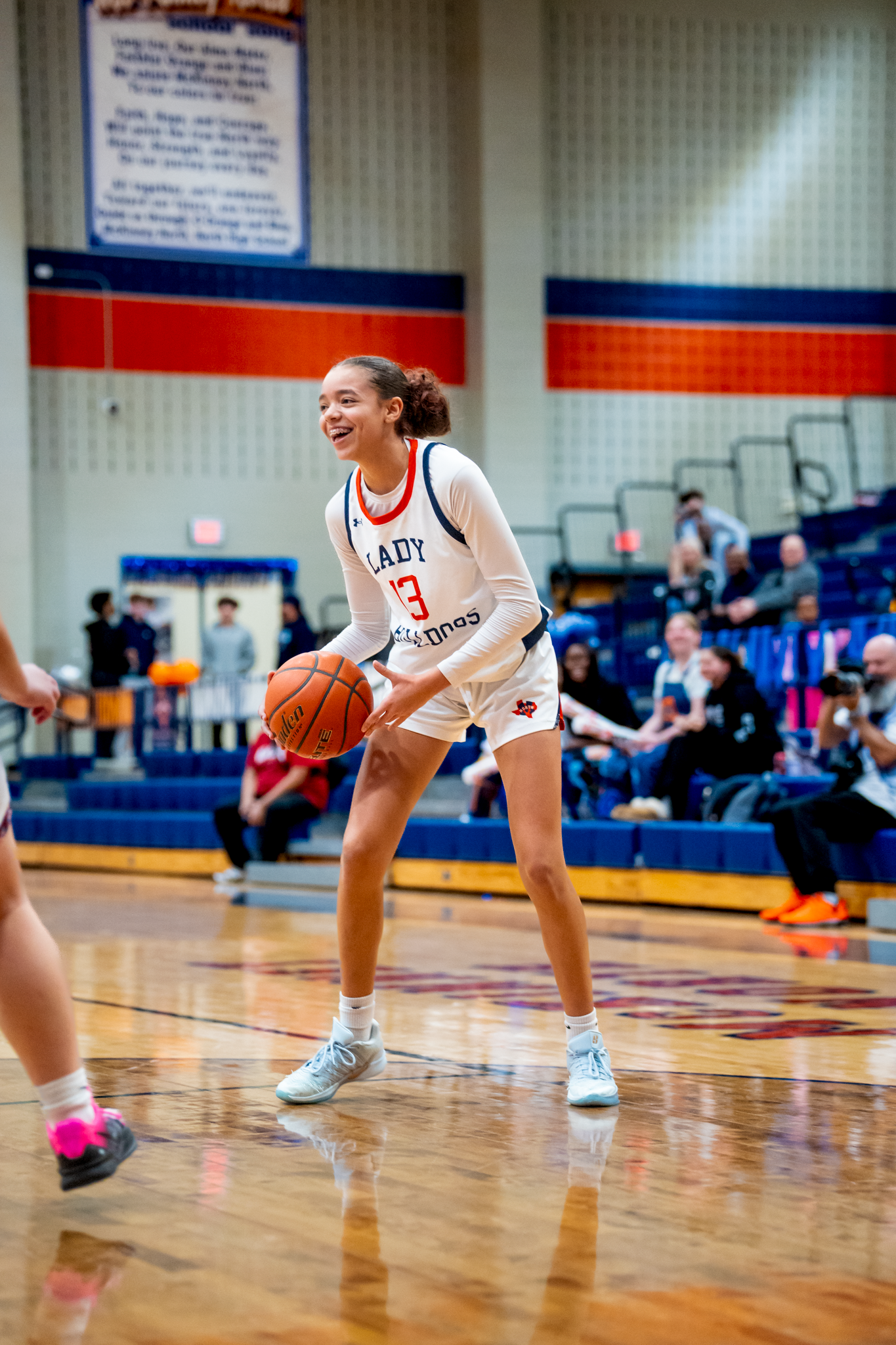 High school basketball player dribbling during game captured by Kin & Lens Creative Media sports photographer in McKinney Texas