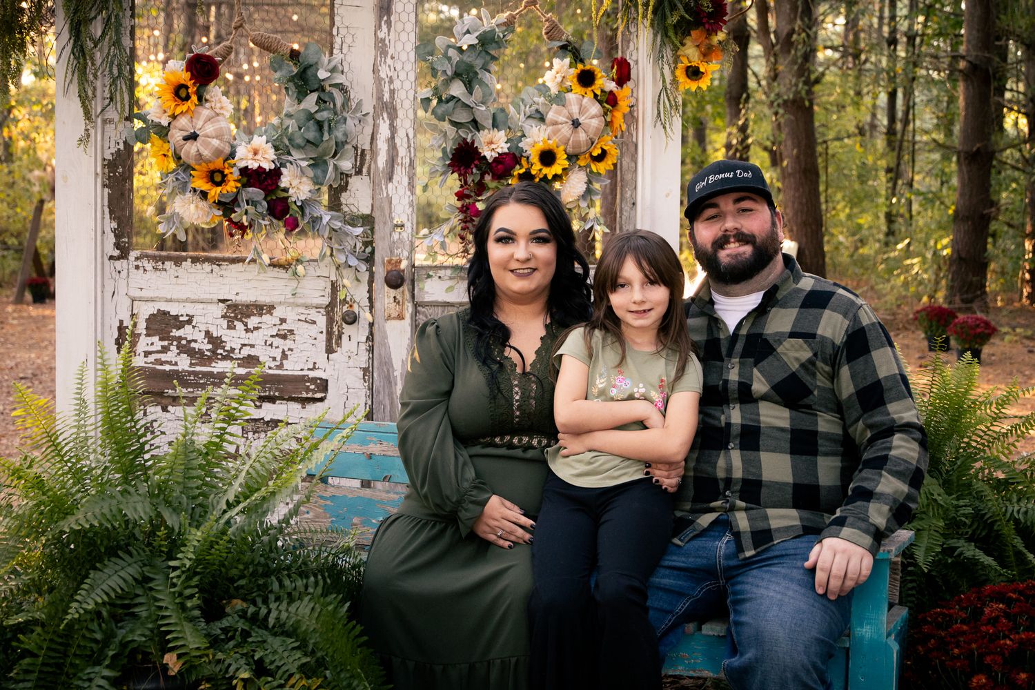 Cozy fall scene with sunflowers and rustic decorations.