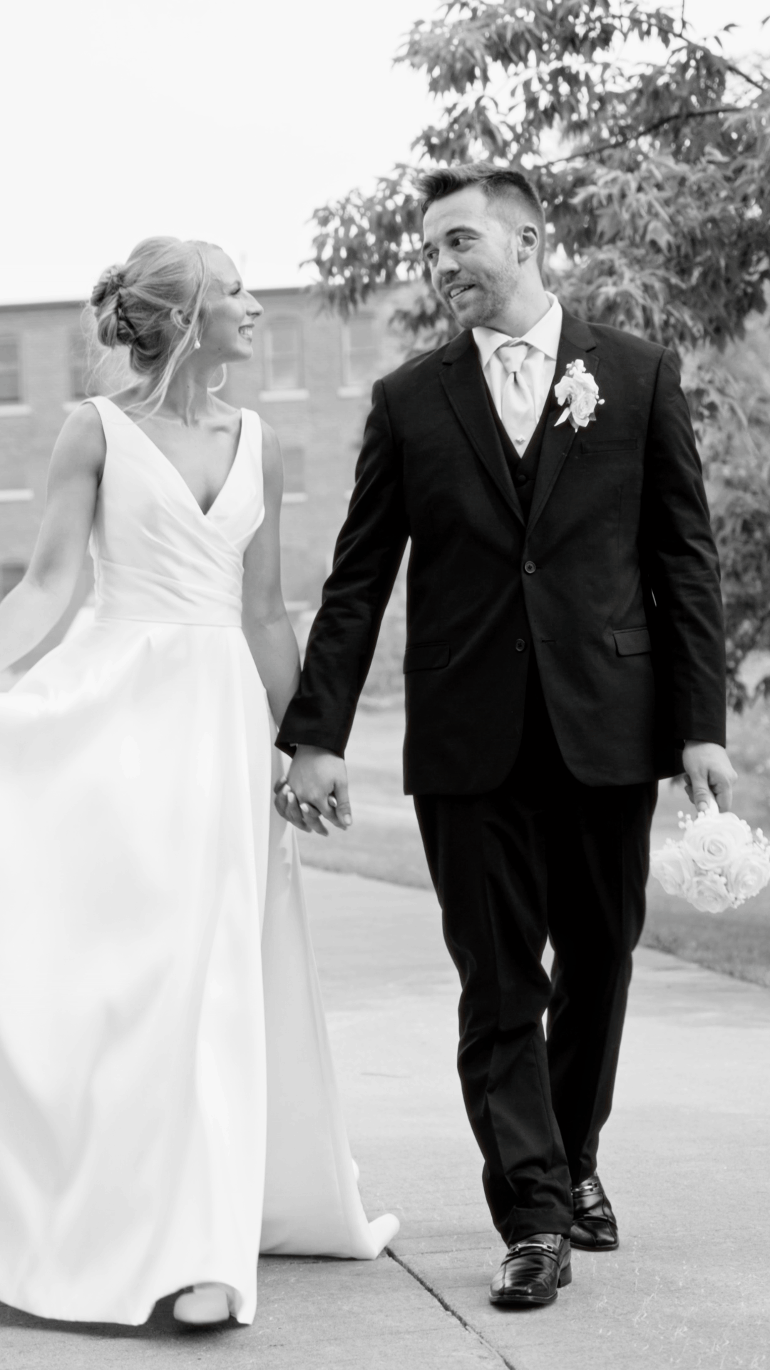 Newlyweds walking and smiling at each other. bride and groom walking and smiling