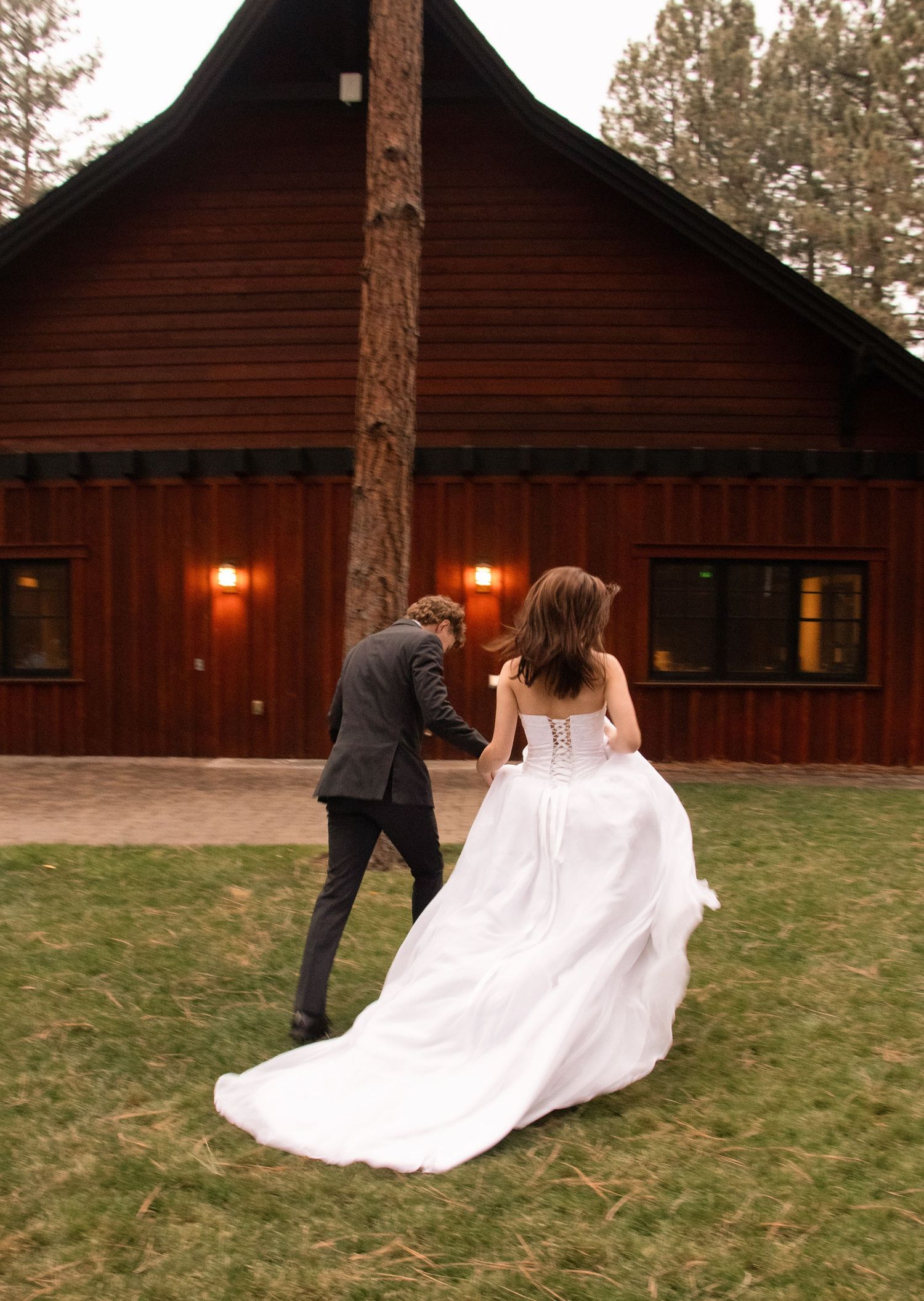 a bride and groom run away together after their Sisters, Oregon wedding ceremony