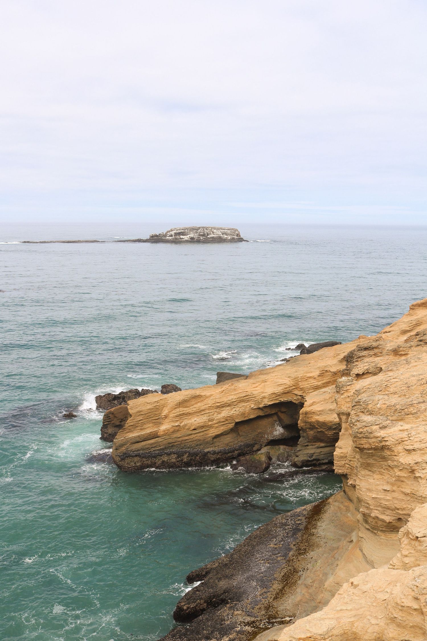 an Oregon Coast landscape of rocks jutting out into the ocean