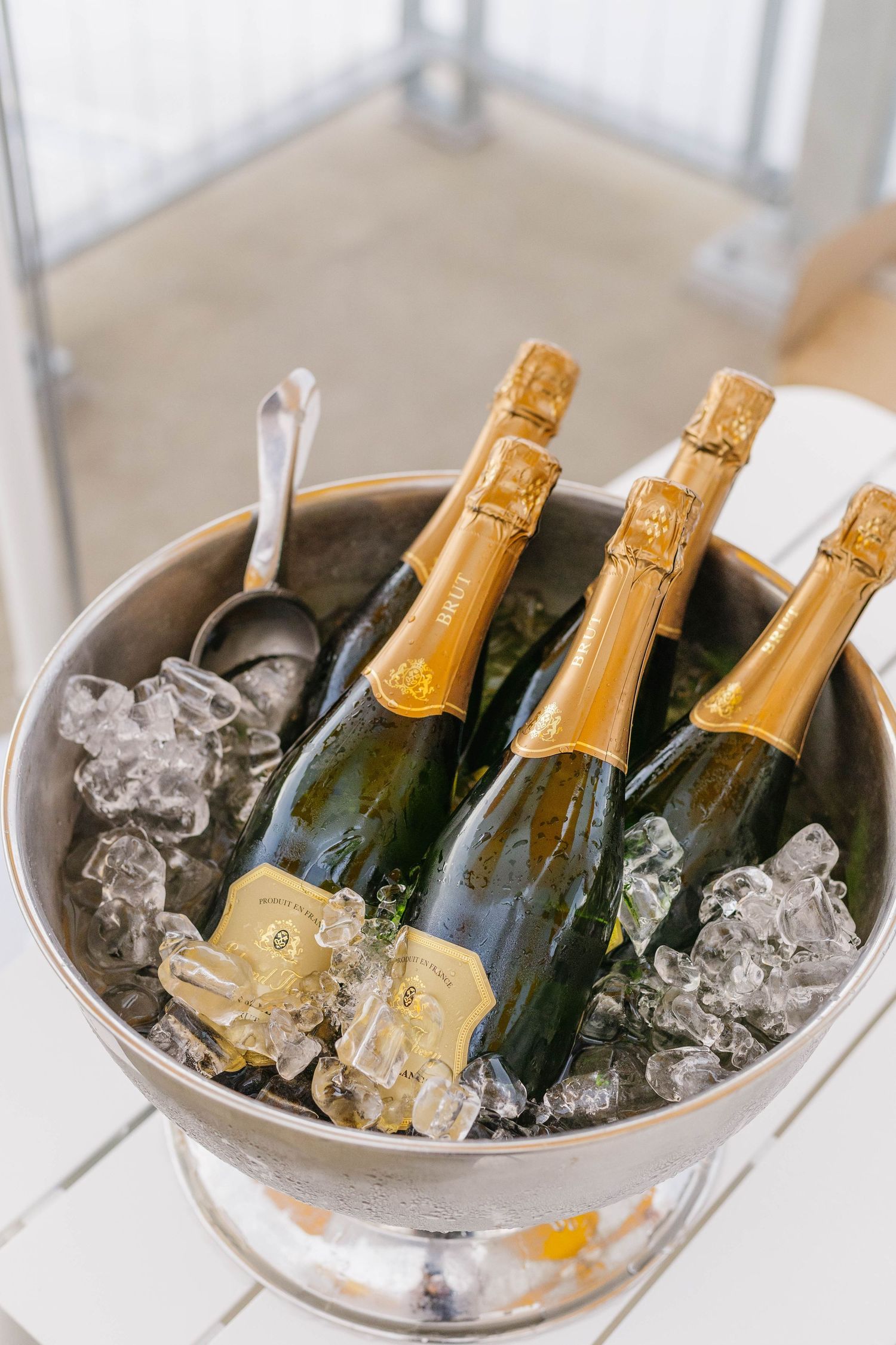 Champagne bottles chilling in ice bucket at celebration event.