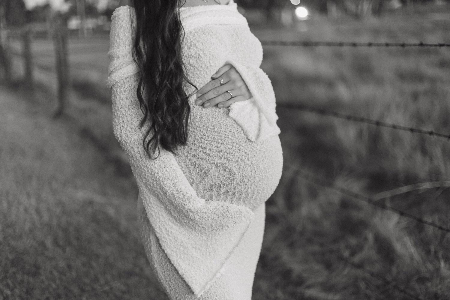 A series of maternity photos showing a woman in a white sweater cradling her baby bump against a natural background.