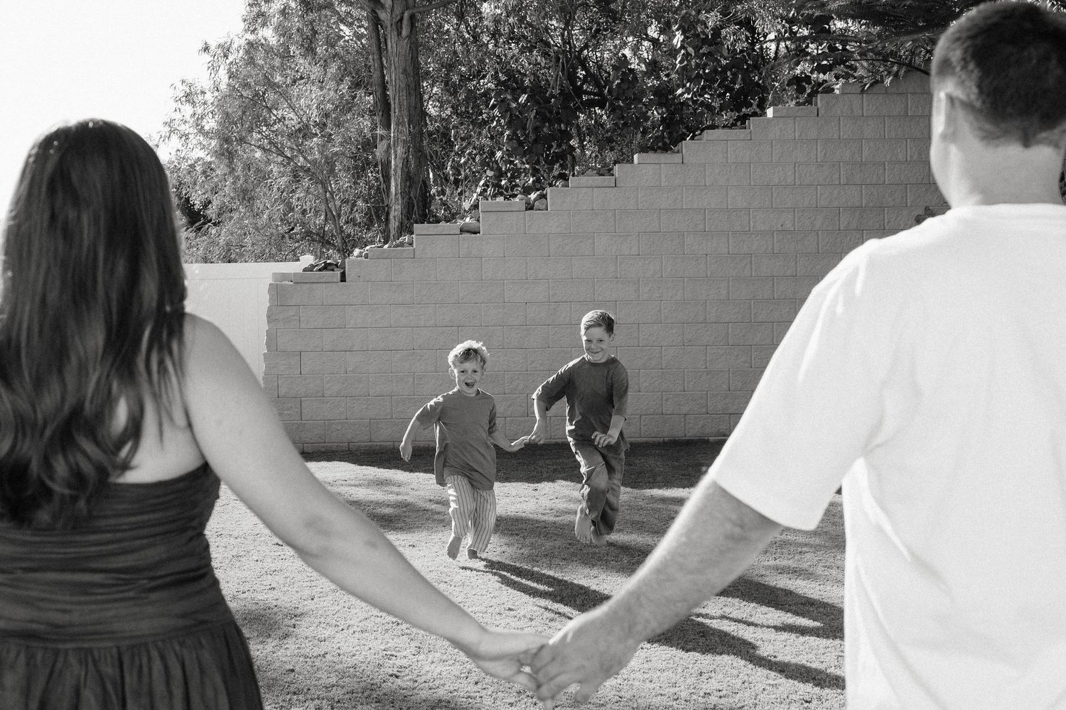 Black and white candid photos of people interacting outdoors.