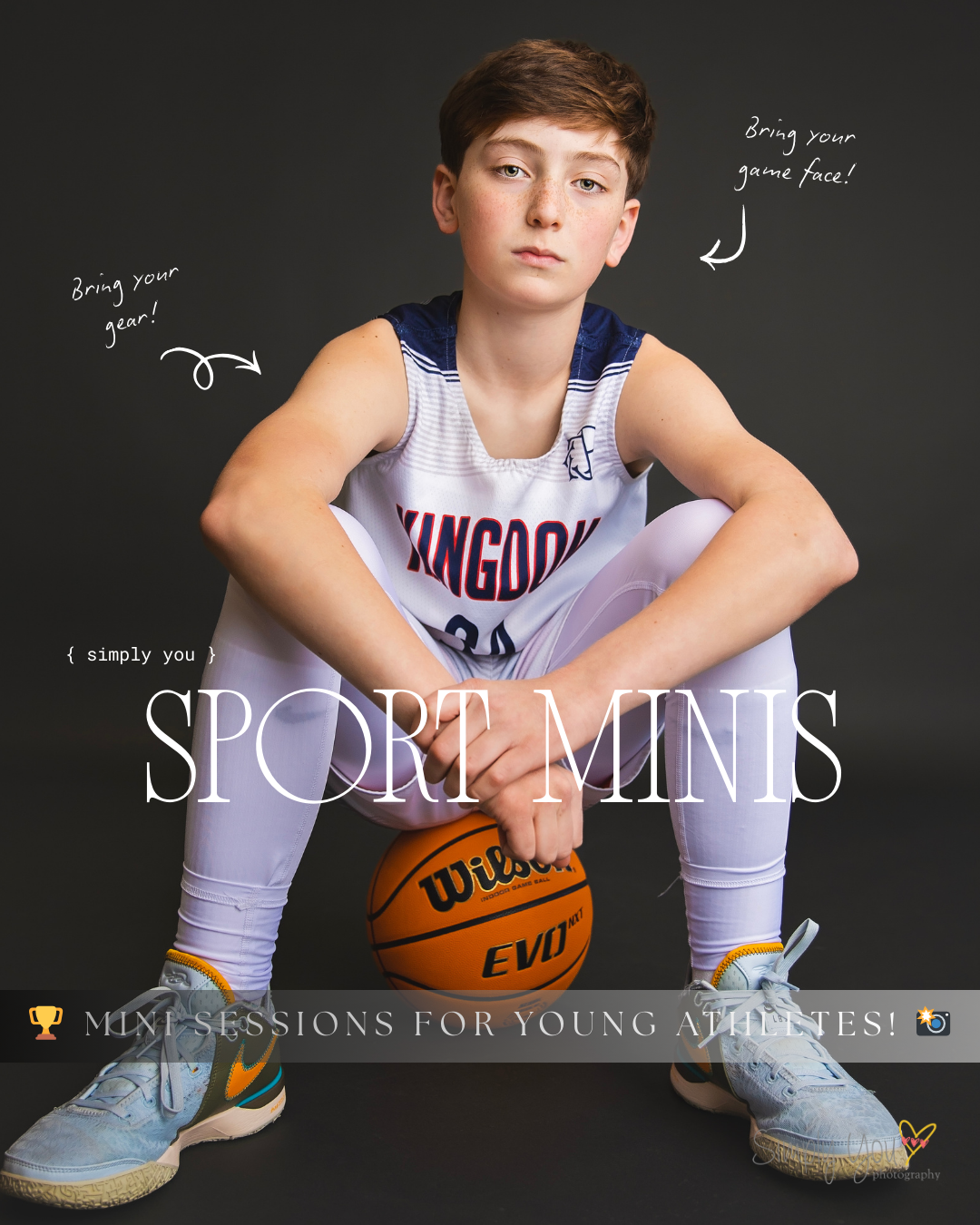 Teen boy in basketball uniform poses with Wilson ball for Simply You Sport Minis photography session.