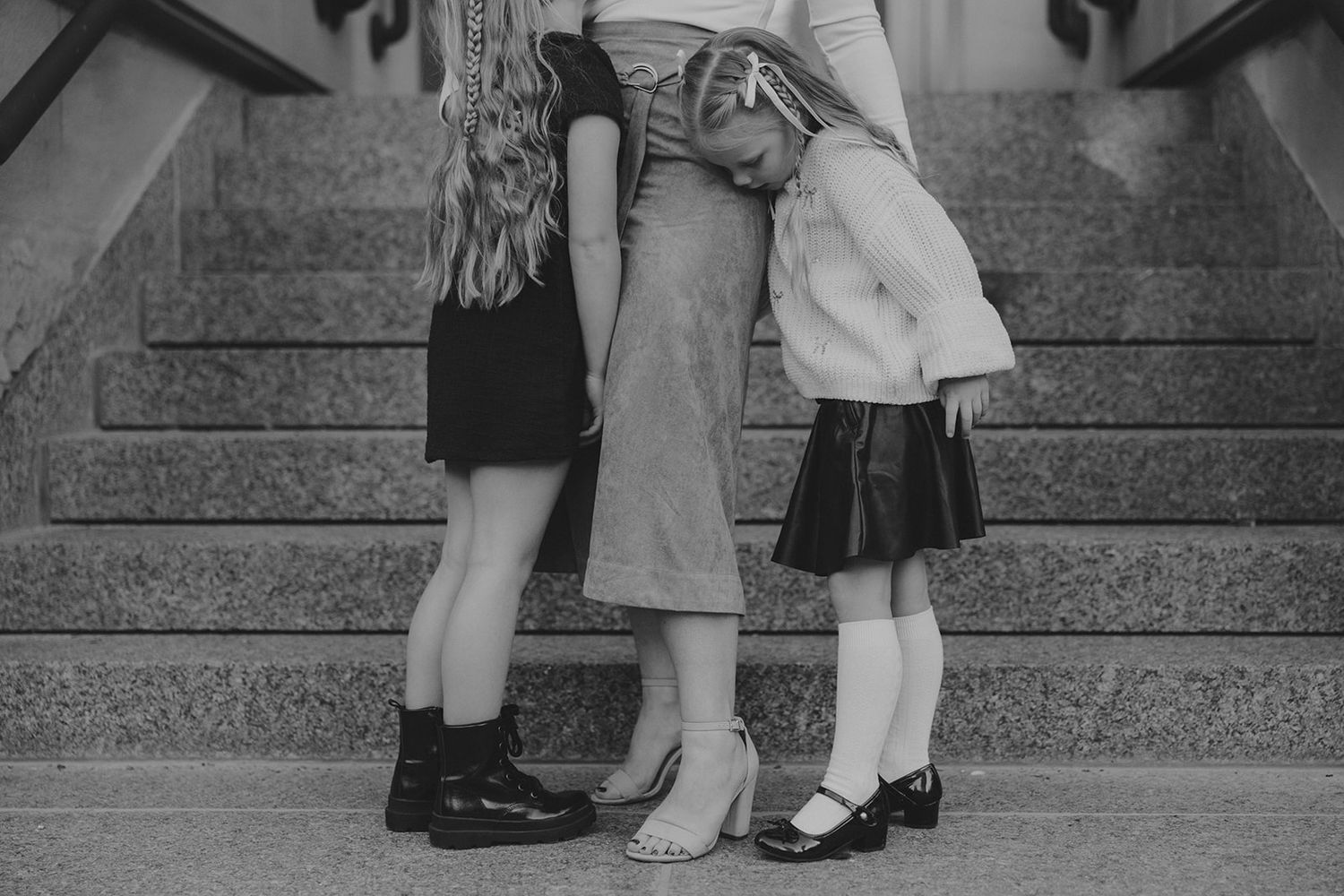 Black and white photo series showing children's feet in dress shoes.