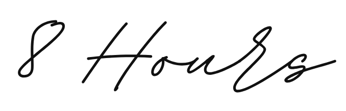 Handwritten signature in black ink appears on a white surface.